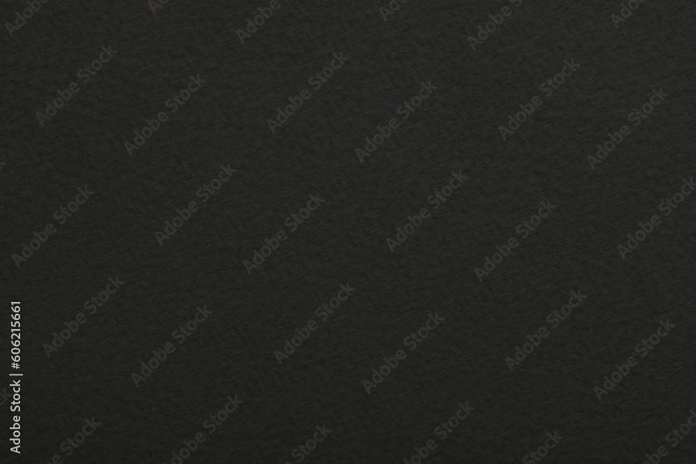 Texture of dark grey paper sheet as background, top view