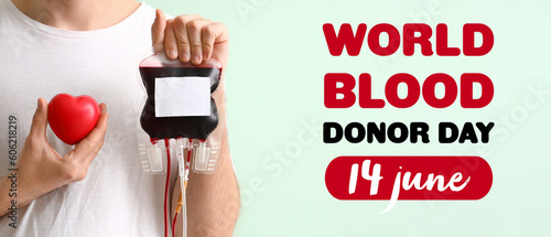 Banner for World Blood Donor Day with man and blood pack photo