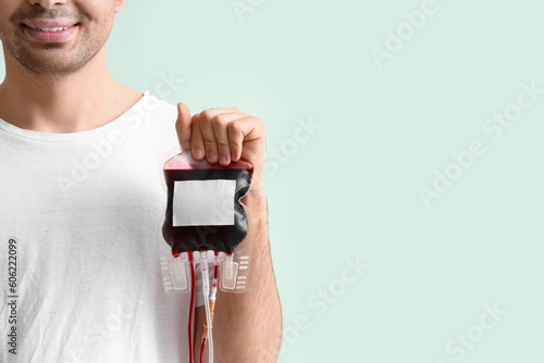 Young donor with blood pack...