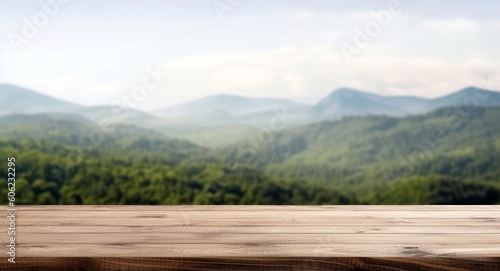Wooden table top with blurred view of mountain landscape in the background.