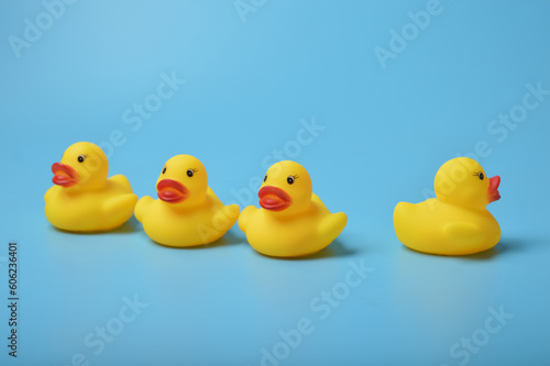 The toy duck gazes in a different direction, embodying a sense of uniqueness, individuality, and embracing diverse creative ideas. The subtle misalignment sparks a delightful misunderstanding photo