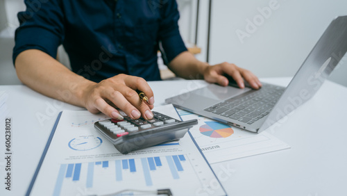Bild auf Leinwand Young asian business man audit analysis graph company budget report, cash inflow