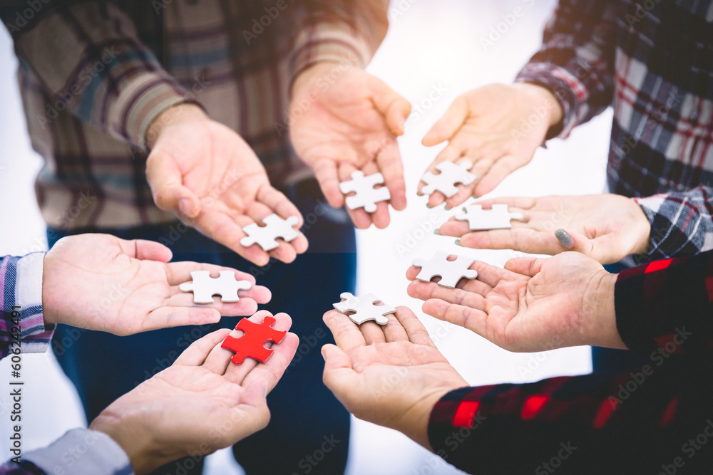 Business team is connecting puzzle pieces, unity, cooperation, teamwork. Business team is connecting puzzle pieces, unity, cooperation, teamwork.