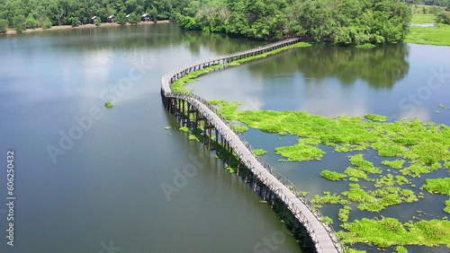 Nong Yai Pond and Wooden Bridge in Chumphon, Thailand photo