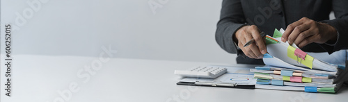 Fotografía copy space, banner, panorama Businesswoman working in piles of papers looking for marketing and financial data reports on desk, business report papers, folders, folders to prepare meeting in office