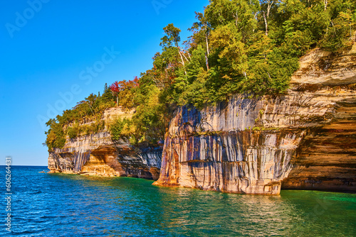 Turquoise green waters with soaring cliffs of pictured rocks national park