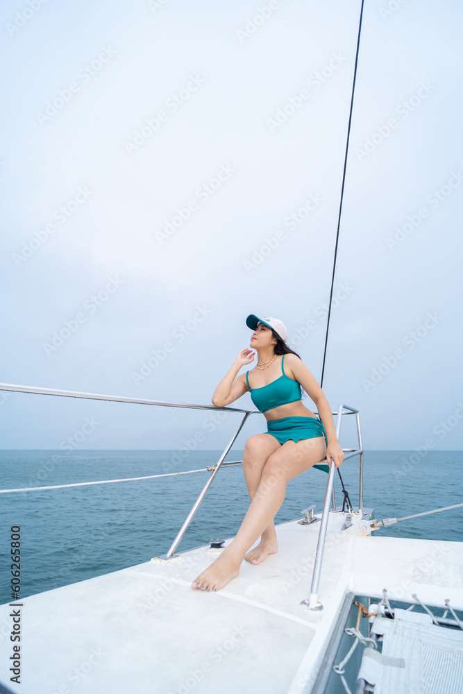 Woman in sarong yachting white sails cruise luxury travel vacation. Young sexy woman on her private yach. Woman in sarong yachting white sails cruise luxury travel vacation. Young sexy woman on her private yach.