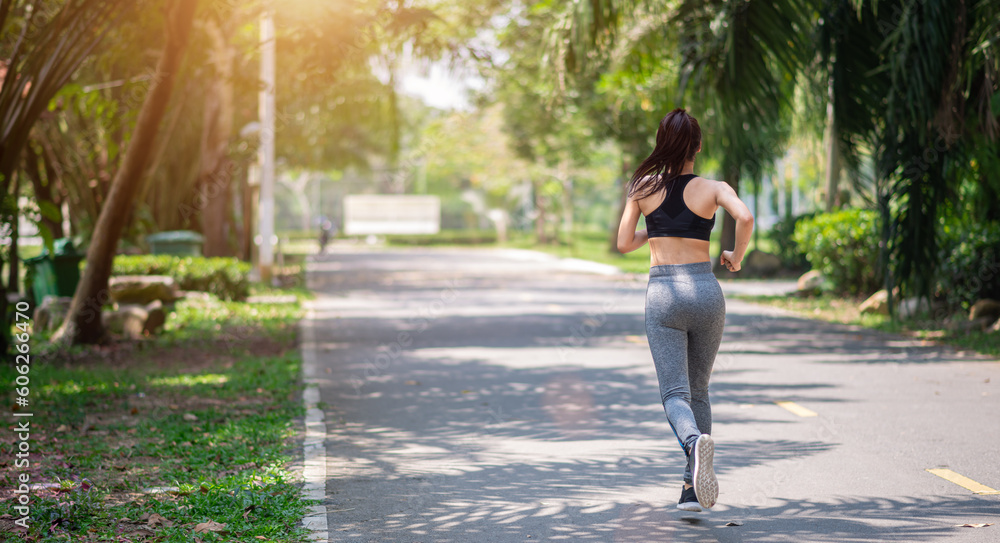 young asian woman runner athlete running at garden