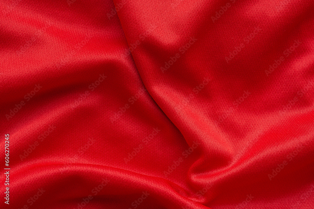 Obraz premium Red sports clothing fabric football shirt jersey texture background