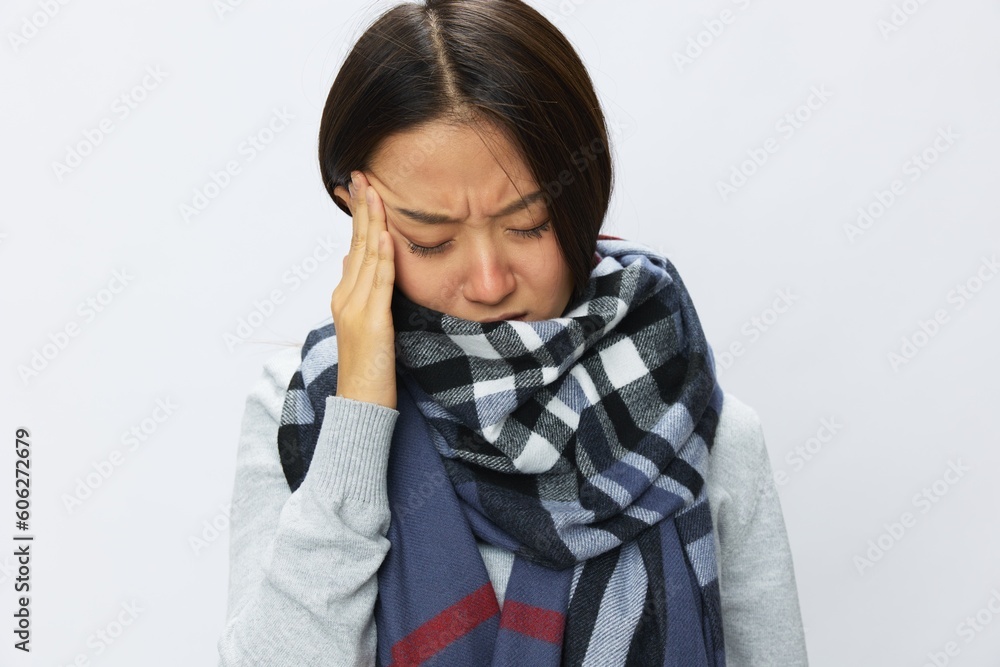 Asian woman cold flu raised hands from headache with fever sick from virus on white background, copy space Asian woman cold flu raised hands from headache with fever sick from virus on white background, copy space