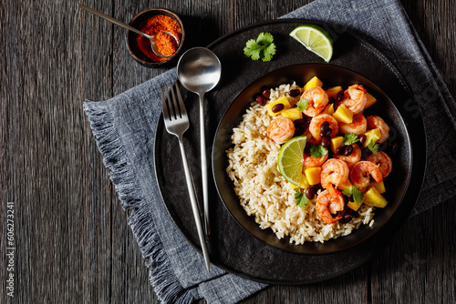 shrimps with beans, mango, brown rice in bowl