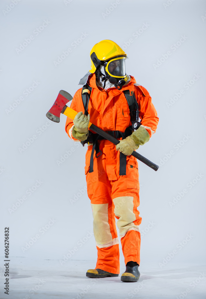 Positioned on a pristine white background a professional firefighter grasps an iron axe firmly in both hands showcasing his strength and preparedness for any firefighting scenario. Positioned on a pristine white background a professional firefighter grasps an iron axe firmly in both hands showcasing his strength and preparedness for any firefighting scenario.