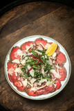 beef Carpaccio with salad and parmesan cheese