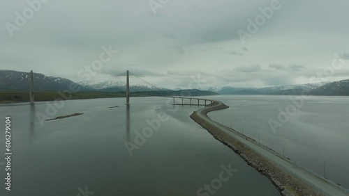 Cyclist approaching the Helgeland Bridge in Norway photo