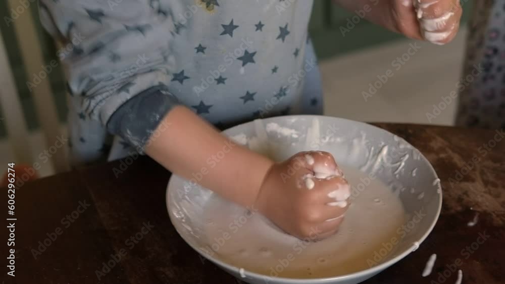 Newtonian fluid. Smart Curious School Children Playing With Homemade Water and Corn Starch Based