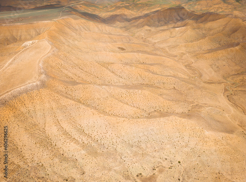 Top aerial view of snake curved road. Winding mountains road. View from above. Driveway serpentine with cars