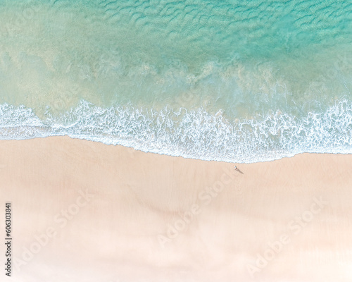 Beautiful beachside destinations pictured with sand, pristine blue water and gentle waves breaking on a beach © FRPhotos