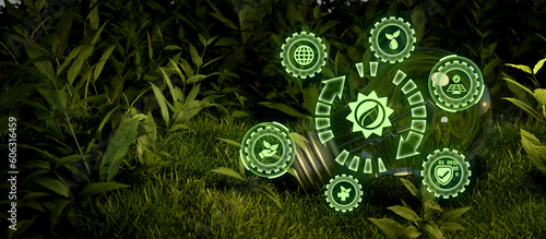 Solar renewable energy banner background with green energy as wind turbines and solar panels in lightbulb.