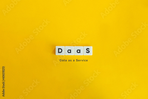 DaaS (Data as a Service) Acronym and Concept. Block Letter Tiles on Yellow Background. Minimal Aesthetic.