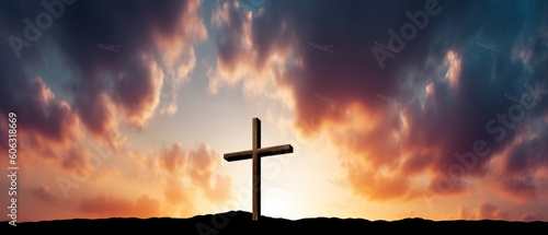 Easter concept, Cross of Jesus Christ empty over dramatic sunrise sky panorama with sclouds copy space on left