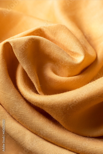 Orange color of lyocell fabric for summer fabric swatch. Modern fashion texture for quality clothing photo