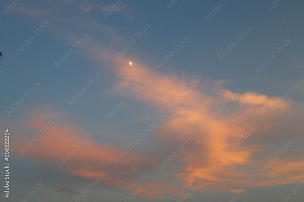 Sunset sky, clouds, and moon