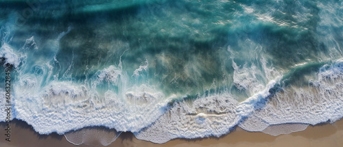 Top view of blue ocean waves at the beach