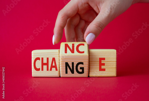 Build your brand symbol. Businessman hand turns wooden cubes with words Chance and Change. Beautiful red background. Chance and Change and business concept. Copy space