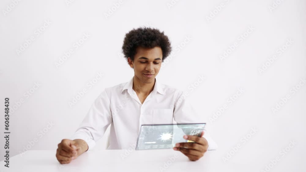 Male laboratory scientist monitoring virus modification on holographic tablet. Futuristic technology on white background Male laboratory scientist monitoring virus modification on holographic tablet. Futuristic technology on white background