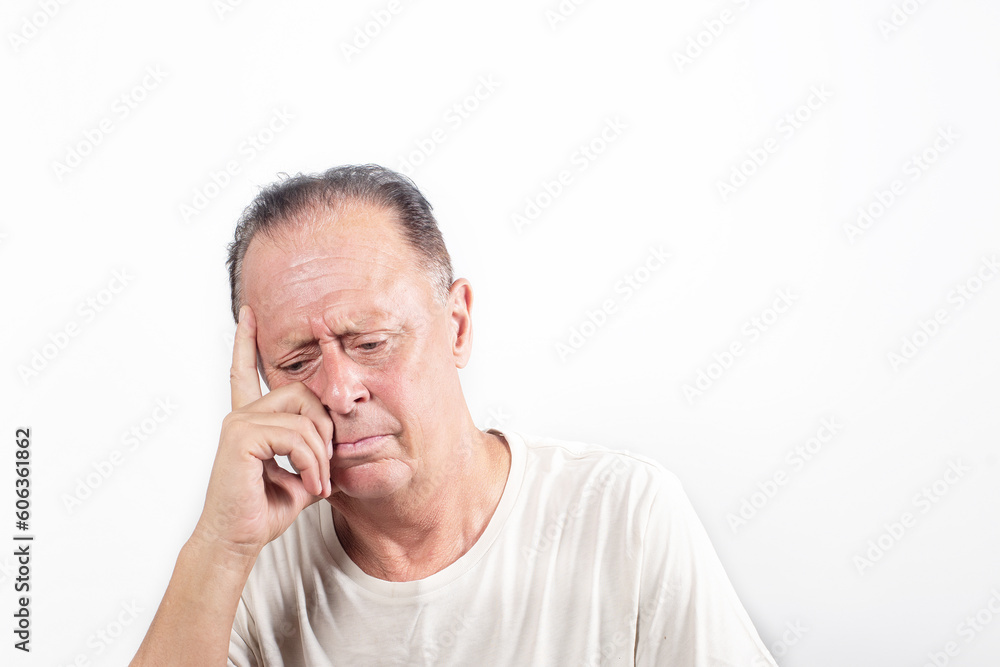 Serious middle-aged man with white shirt having doubts and with confuse face expression while scratching head on isolated white background Serious middle-aged man with white shirt having doubts and with confuse face expression while scratching head on isolated white background
