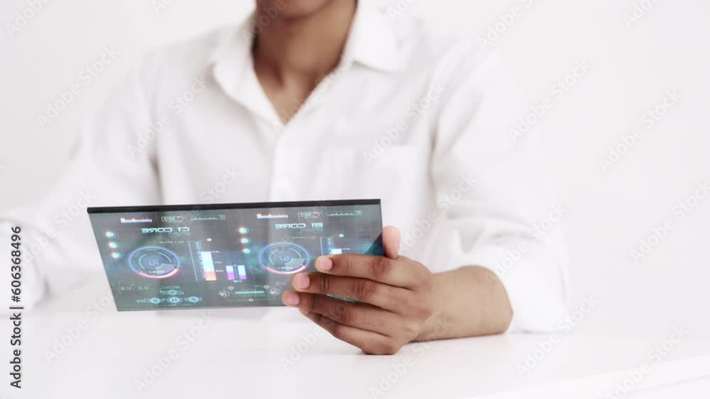 Close-up of mechanic having remote engine control on advanced tech equipment. Futuristic technology on white background Close-up of mechanic having remote engine control on advanced tech equipment. Futuristic technology on white background