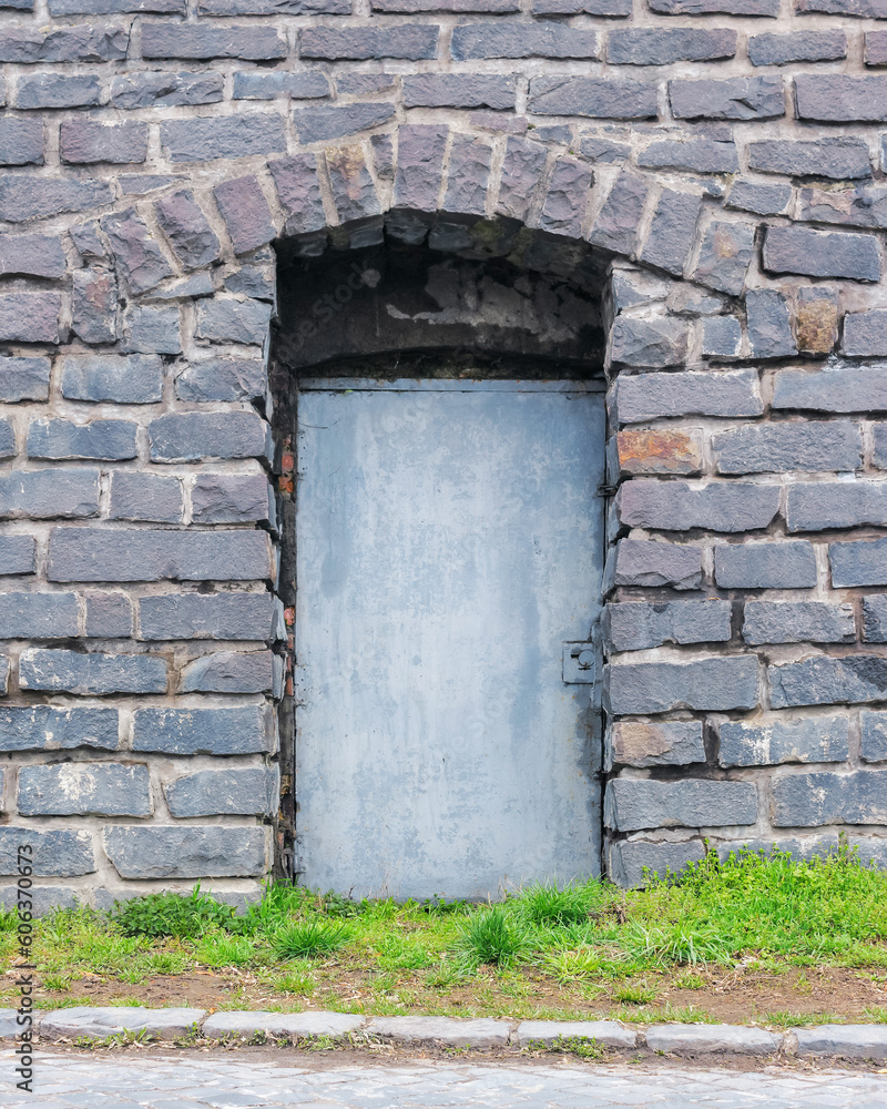 door on the old grunge facade. architectural element door on the old grunge facade. architectural element