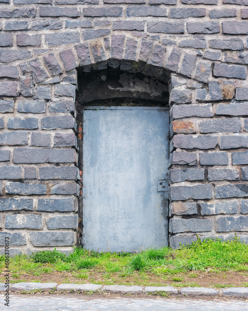 door on the old grunge facade. architectural element