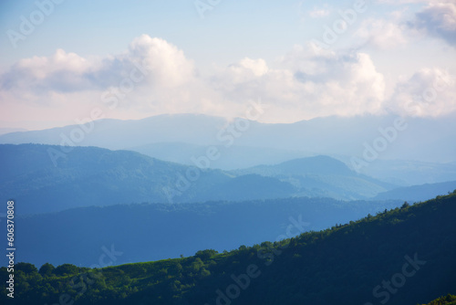 nature scenery with mountains and valleys. landscape background with forested rolling hills in summer