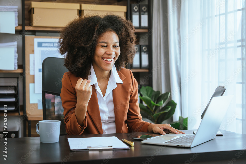 Obraz premium Working smart, African american business woman working audit balance sheet, job order costing, revenue recognition, break-even analysis, appropriated retained earnings, earned surplus, capital gain