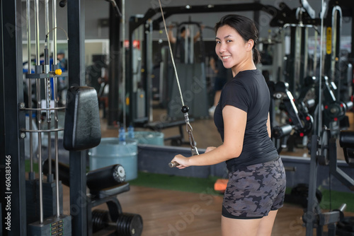 Asian woman exercising at the gym.Fitness and wellness concept.
