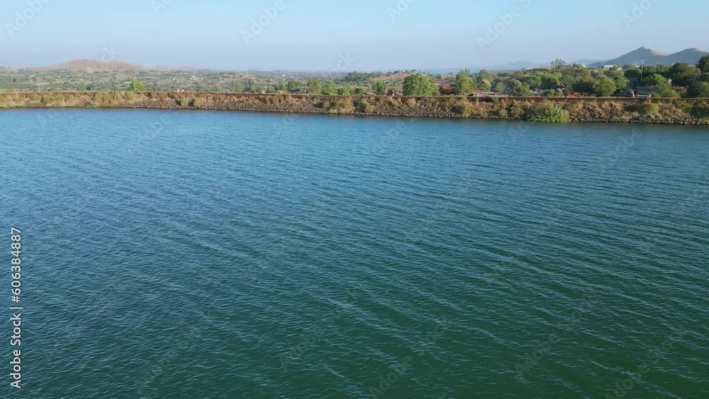 Shot flying over Kashyapi dam and mountain in horizon, Nashik Maharashtra - 4K Dolly Shot Shot flying over Kashyapi dam and mountain in horizon, Nashik Maharashtra - 4K Dolly Shot