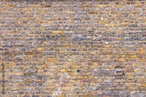 Old weathered brick wall texture. Grunge urban street brick wall
