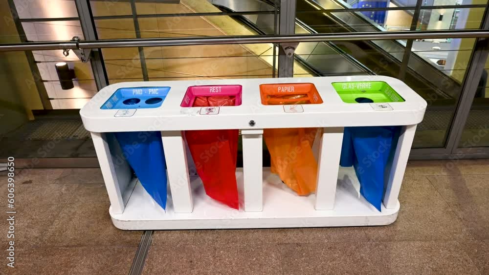 Separated garbage bins. Trash cans for plastic, paper, glass and rest