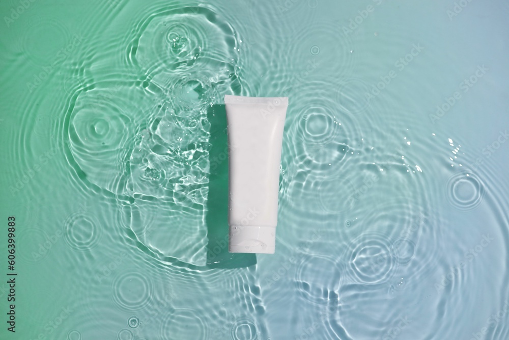 Fototapeta premium White toothpaste tube isolated on a light pastel background