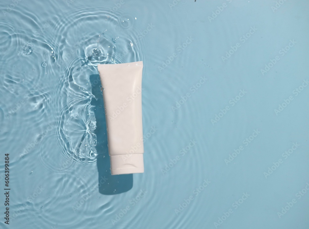White toothpaste tube isolated on a light pastel background White toothpaste tube isolated on a light pastel background
