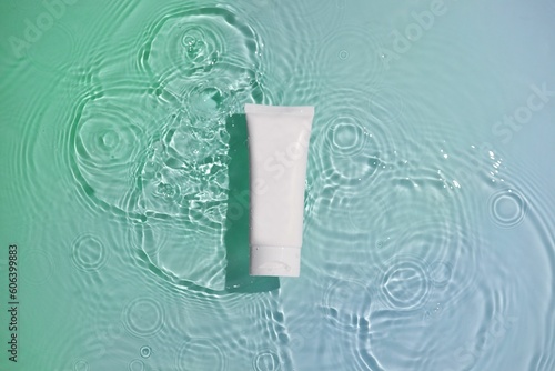 White toothpaste tube isolated on a light pastel background