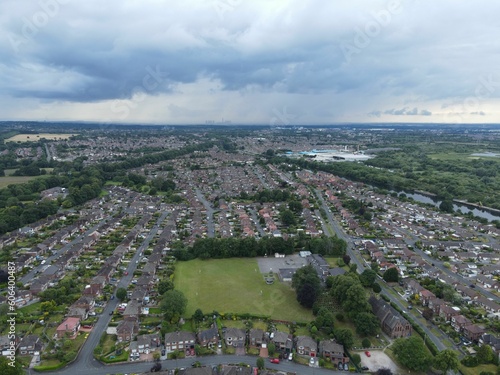 Bird's-eye view of a suburban area under a cloudy sky