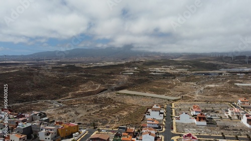 Drone cityscape view of La Jaca town with mount and cloudy sky in Tenerife, Canary Islands, Spain