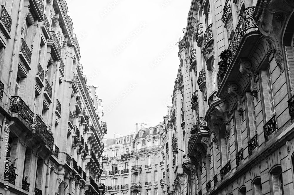 Low angle of beautiful old buildings of Paris, France shot in grayscale