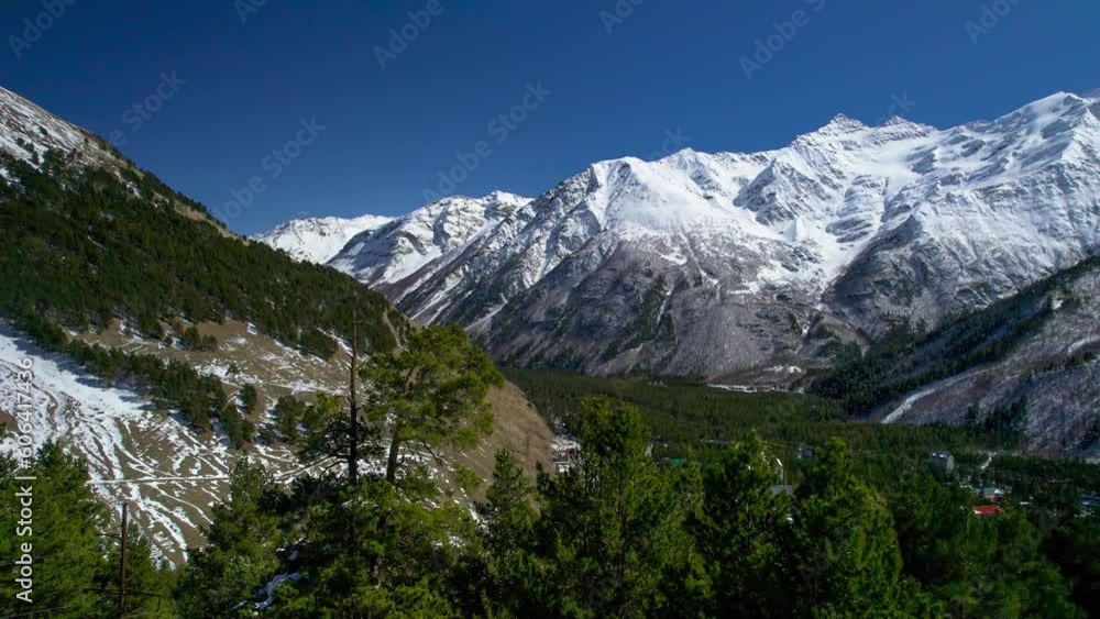 Beautiful aerial view of mountainous area and snowy peaks. Landscape and nature of the North Caucasus Beautiful aerial view of mountainous area and snowy peaks. Landscape and nature of the North Caucasus