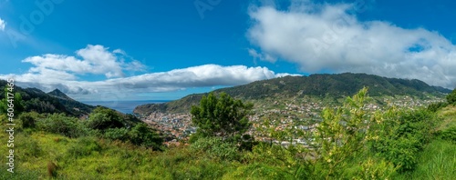 Panoramic view of mountain Madeira with green plants and a cloudy sky