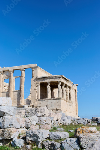 Ancient temple Parthenon in Acropolis Athens Greece on a bright blue sky background. The best travel destinations. Vertical photo.