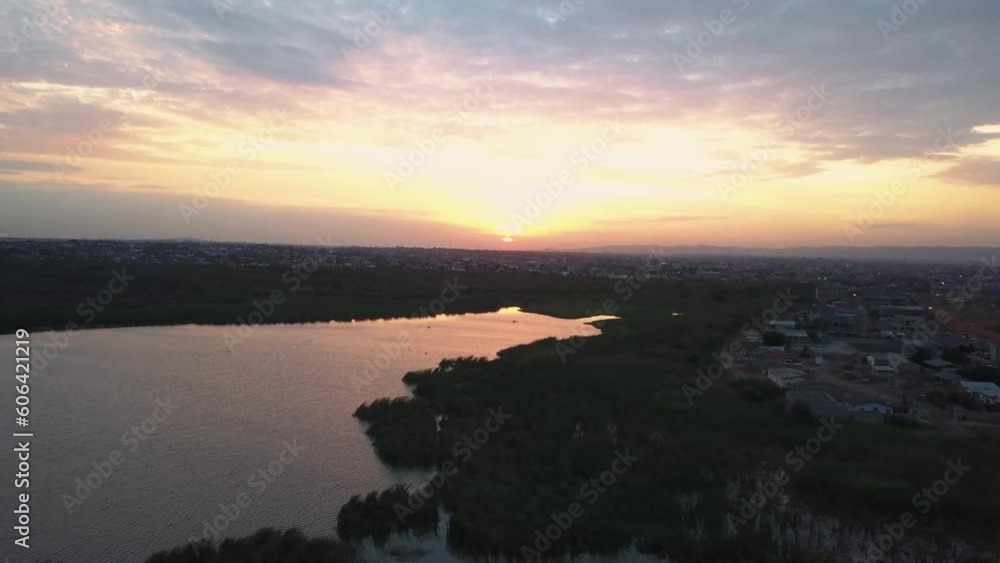Drone shot of a beautiful sunset over a dam in East Legon Hills, Accra Ghana, West Africa Drone shot of a beautiful sunset over a dam in East Legon Hills, Accra Ghana, West Africa