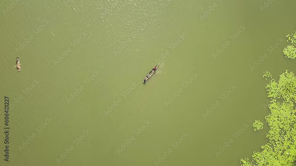 Bird's eye view of fishermen on a boat in the marshes outside Accra, Ghana, West Africa Bird's eye view of fishermen on a boat in the marshes outside Accra, Ghana, West Africa